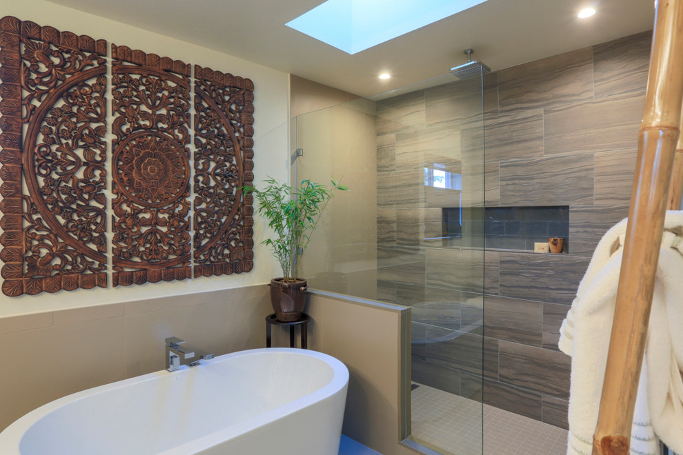 Mid-sized asian master bathroom in Seattle with flat-panel cabinets, dark wood cabinets, a freestanding tub, a double shower, a two-piece toilet, beige tile, porcelain tile, beige walls, porcelain floors, an undermount sink and granite benchtops.