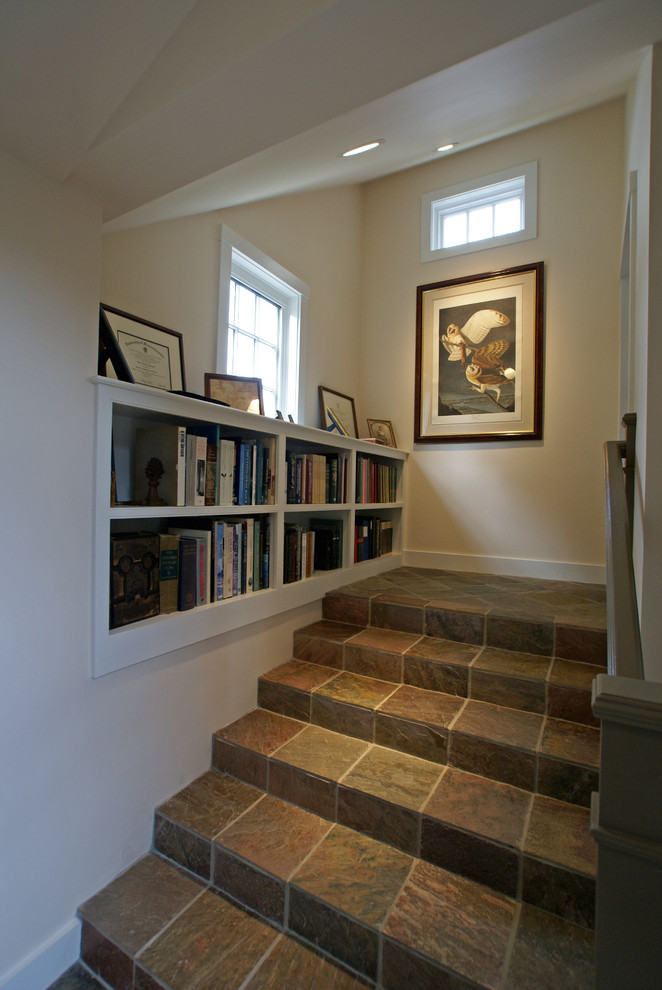 This is an example of a mid-sized traditional slate straight staircase in Boston with slate risers.