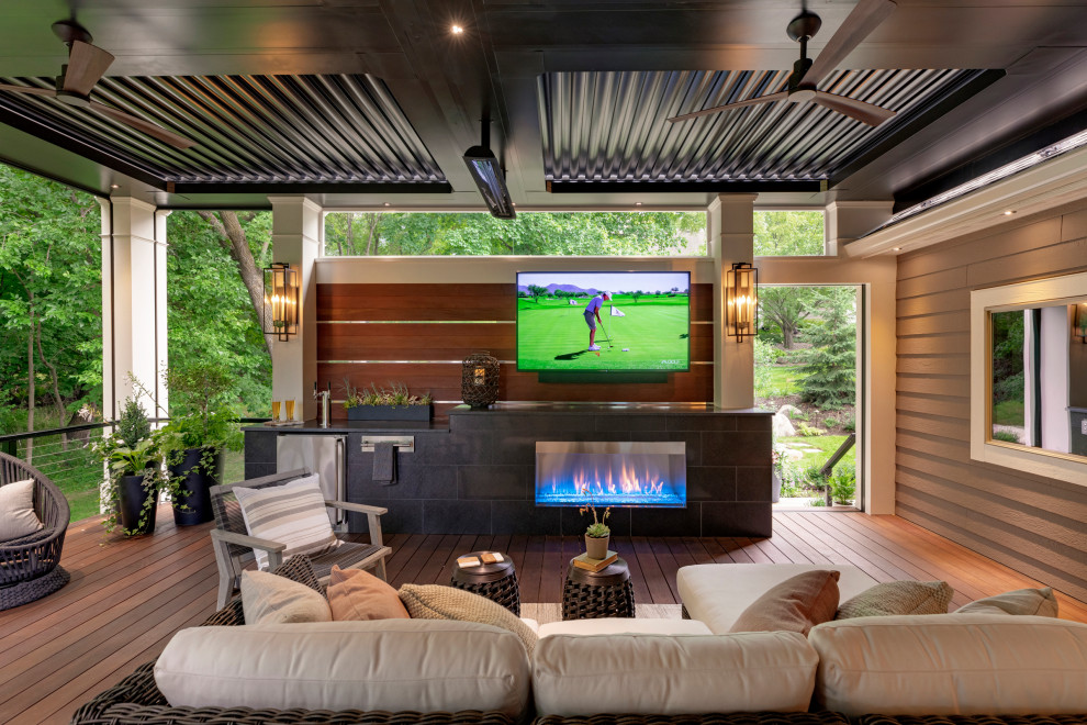 Inspiration for a mid-sized contemporary backyard deck in Minneapolis with with privacy feature and a pergola.