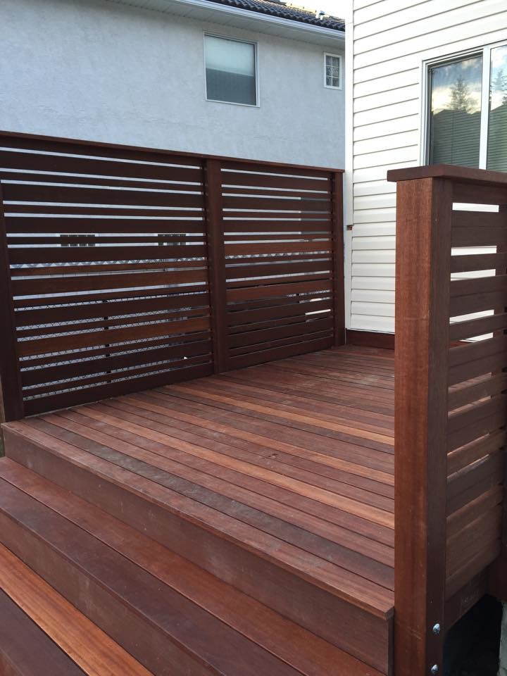 Deck - small transitional backyard deck idea in Calgary with no cover
