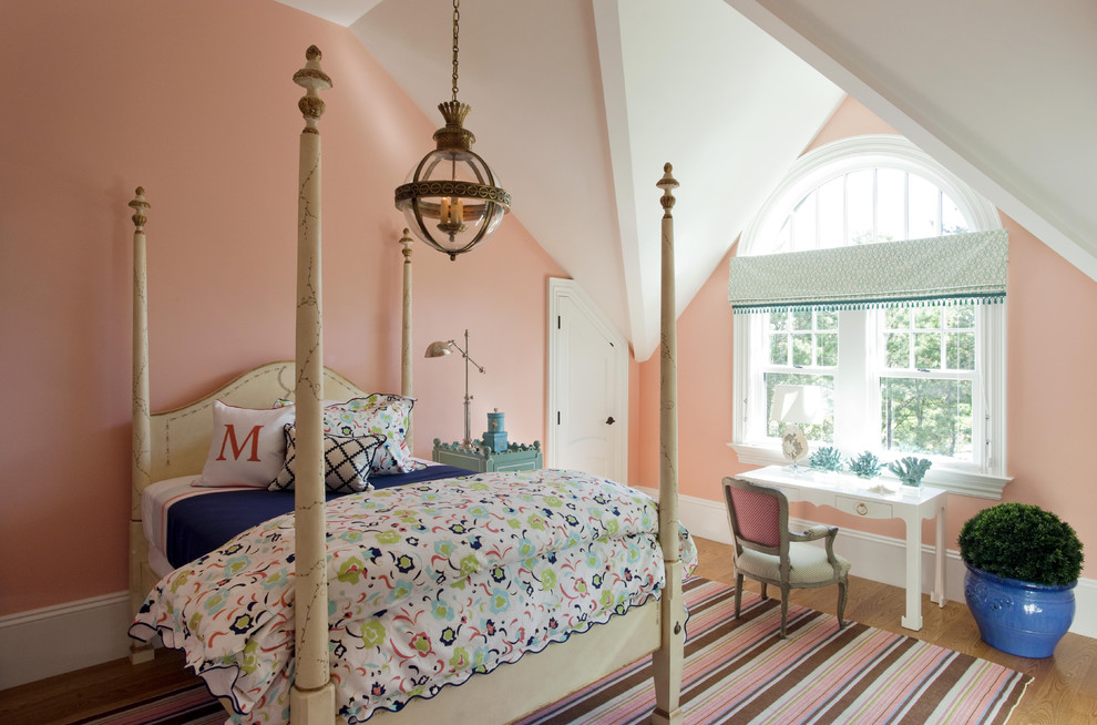 This is an example of a contemporary kids' room for girls in Boston with pink walls.