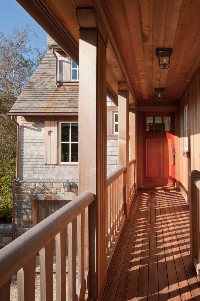 This is an example of a traditional entryway in Boston with a single front door and a medium wood front door.