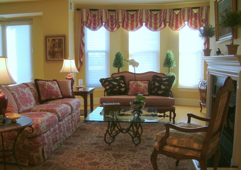 Photo of a traditional open concept living room in DC Metro with yellow walls.