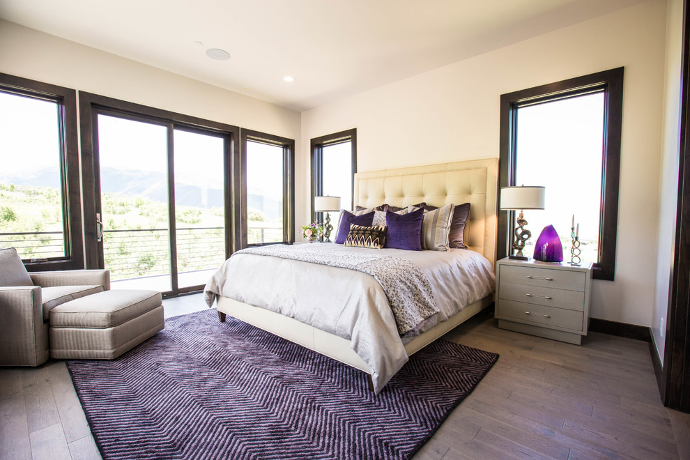 Inspiration for a large contemporary master bedroom in Salt Lake City with beige walls, medium hardwood floors, no fireplace and brown floor.