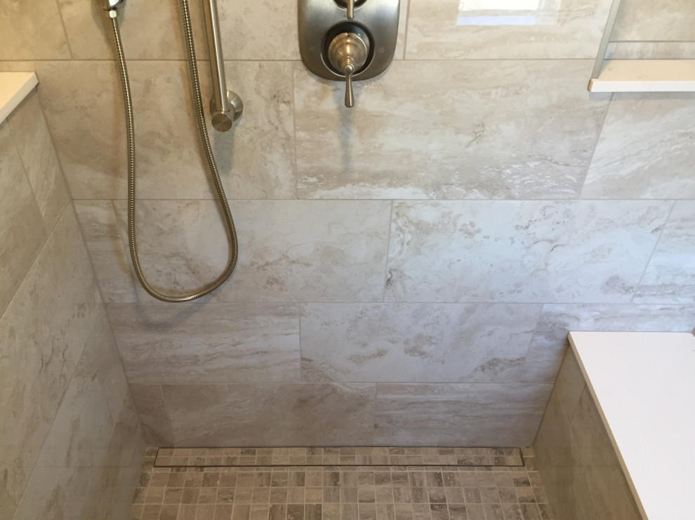 This is an example of a large traditional master bathroom in Orange County with an open shower, beige tile, porcelain tile and an open shower.