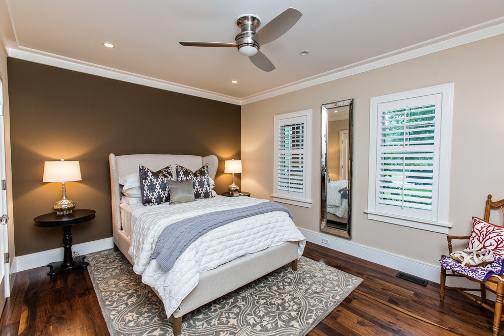 Photo of a transitional bedroom in Charleston with brown walls and dark hardwood floors.