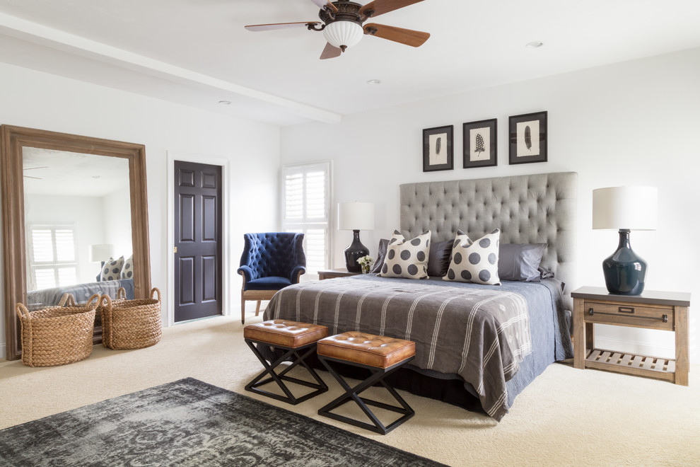 This is an example of a transitional master bedroom in Boston with white walls, carpet and beige floor.
