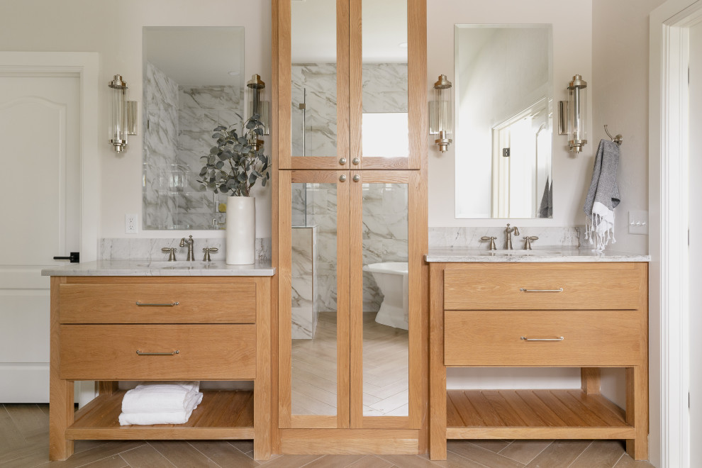 Photo of a transitional master bathroom in Oklahoma City with flat-panel cabinets, light wood cabinets, white walls, an undermount sink, brown floor, white benchtops and a freestanding vanity.