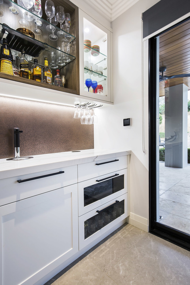 Inspiration for a small modern single-wall wet bar in Sydney with shaker cabinets, white cabinets, quartz benchtops, limestone floors, beige floor, no sink, brown splashback and metal splashback.