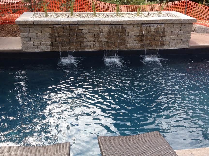 Inspiration for a mid-sized transitional backyard concrete and rectangular lap pool fountain remodel in Toronto