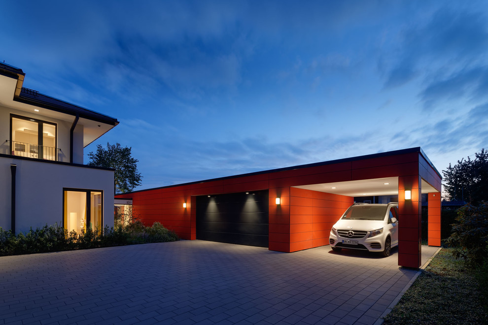 Design ideas for a mid-sized contemporary attached three-car carport in Dortmund.