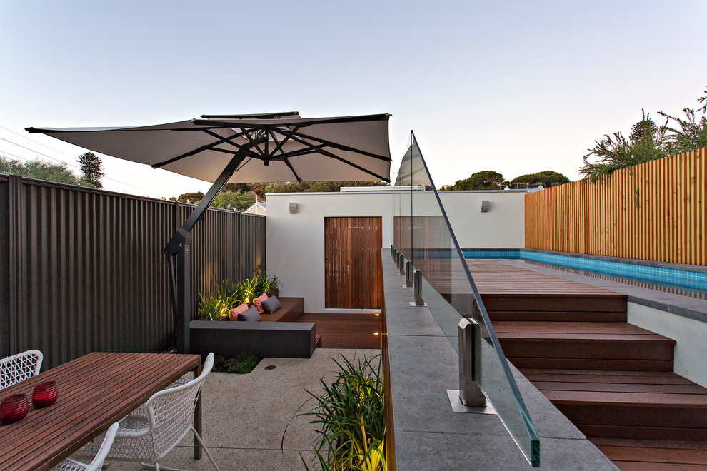 This is an example of a contemporary backyard deck in Perth.