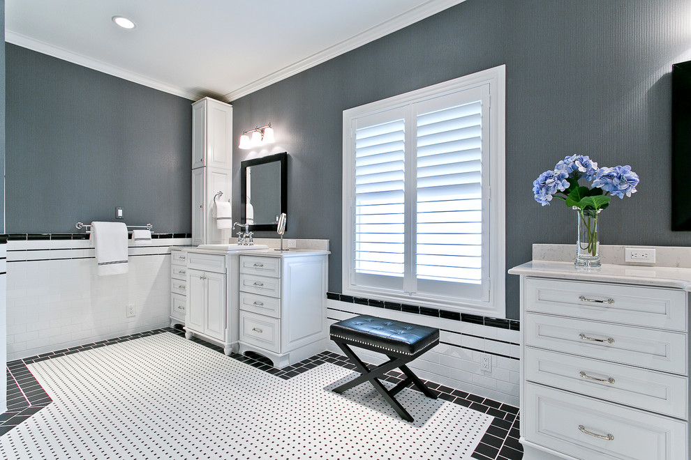 This is an example of a mid-sized traditional master bathroom in Dallas with a drop-in sink, furniture-like cabinets, white cabinets, solid surface benchtops, a two-piece toilet, white tile, porcelain tile and porcelain floors.