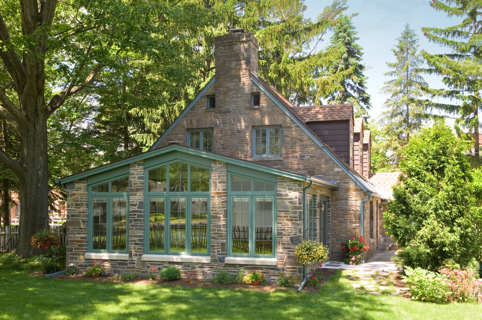 Design ideas for a traditional exterior in Boston with stone veneer.