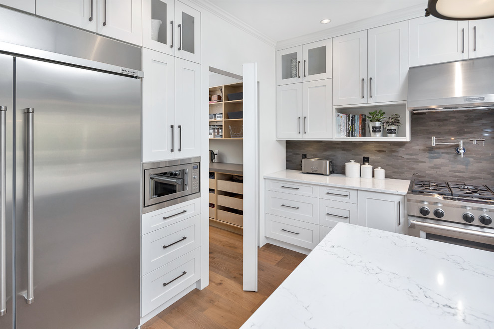 Kitchen - transitional l-shaped dark wood floor and brown floor kitchen idea