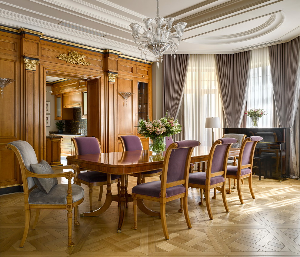 Transitional open plan dining in Saint Petersburg with brown walls, light hardwood floors and beige floor.