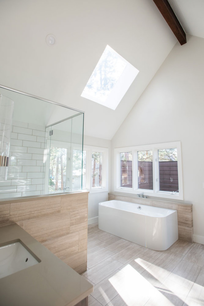 Photo of a mid-sized contemporary master bathroom in Other with shaker cabinets, dark wood cabinets, a drop-in tub, a shower/bathtub combo, white tile, mosaic tile, white walls, medium hardwood floors, an undermount sink and a single vanity.