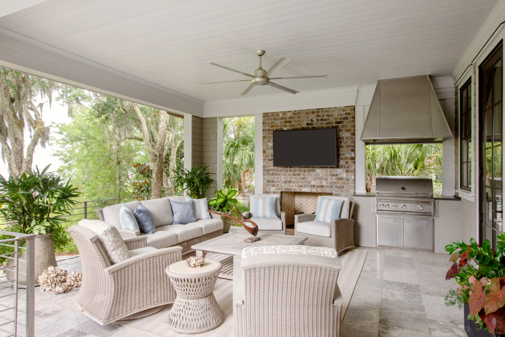 Example of a large beach style patio design in Charleston