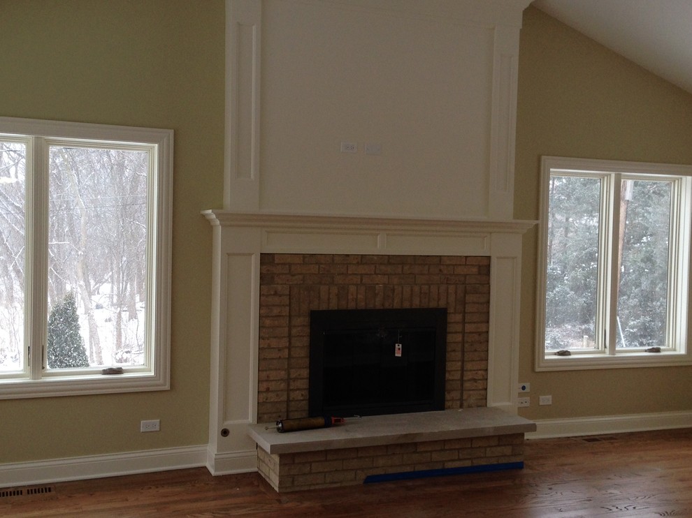 long living room with fireplace in center