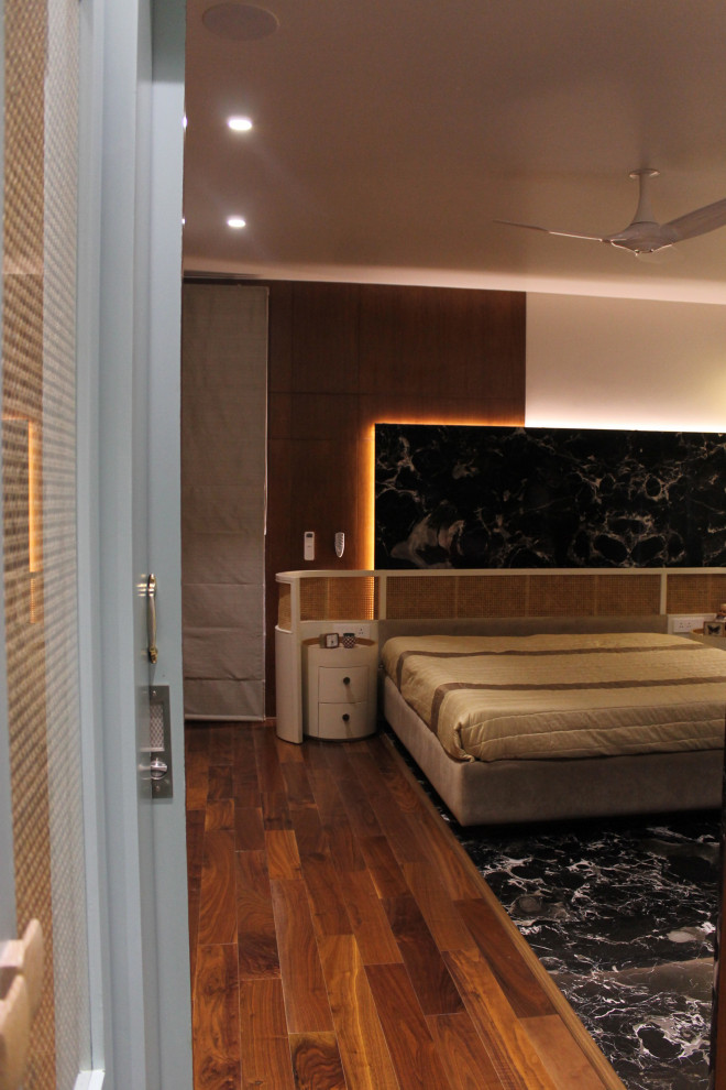 Photo of a contemporary bedroom in Bengaluru.