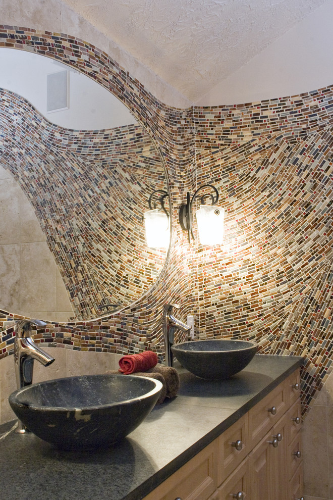 Inspiration for a large mediterranean master bathroom in Minneapolis with a vessel sink, mosaic tile, light wood cabinets, a double shower, multi-coloured tile, beige walls and raised-panel cabinets.