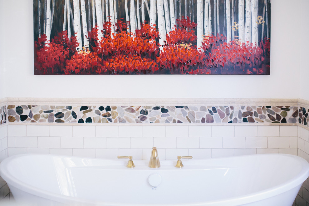 Transitional freestanding bathtub photo with white walls