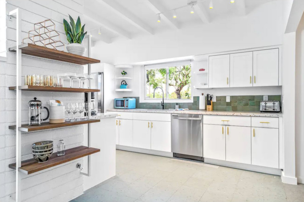 Inspiration for a midcentury galley kitchen in Other with an undermount sink, flat-panel cabinets, white cabinets, green splashback, terra-cotta splashback, stainless steel appliances, vinyl floors, no island, blue floor, multi-coloured benchtop, exposed beam and terrazzo benchtops.