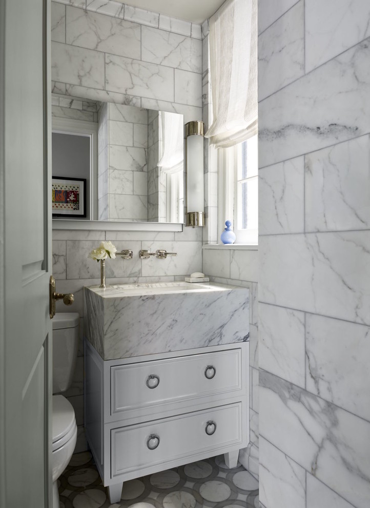 Transitional bathroom in New York with recessed-panel cabinets, white cabinets, a two-piece toilet, grey walls and a vessel sink.