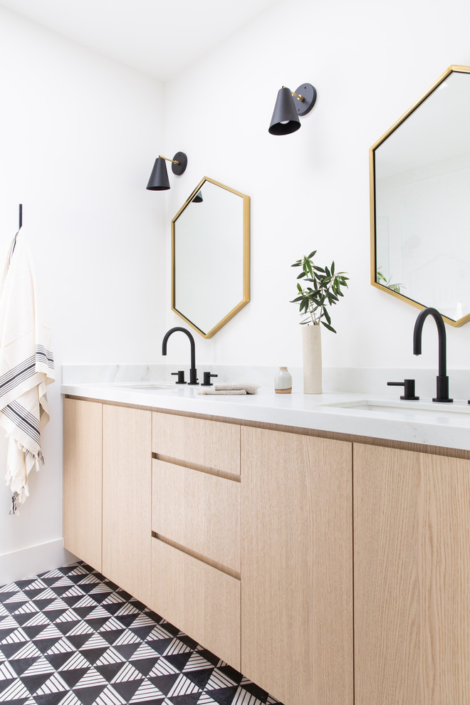 Mid-sized scandinavian master bathroom in San Francisco with flat-panel cabinets, light wood cabinets, white walls, cement tiles, an undermount sink, marble benchtops, multi-coloured floor and white benchtops.
