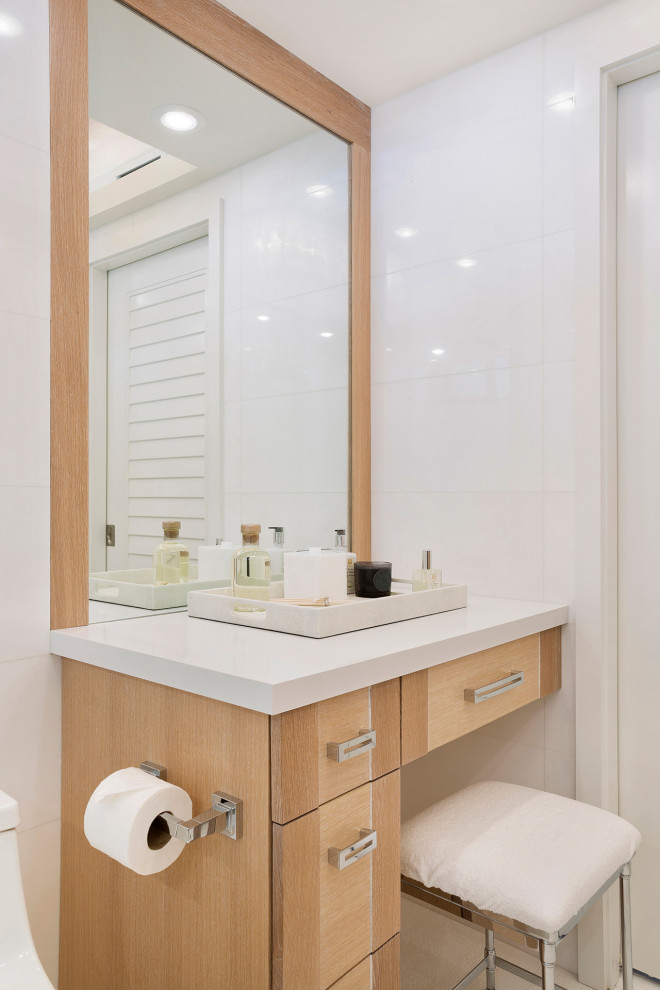 Inspiration for a mid-sized transitional master white tile and porcelain tile porcelain tile and beige floor bathroom remodel in Miami with flat-panel cabinets, a one-piece toilet, white walls, solid surface countertops and white countertops