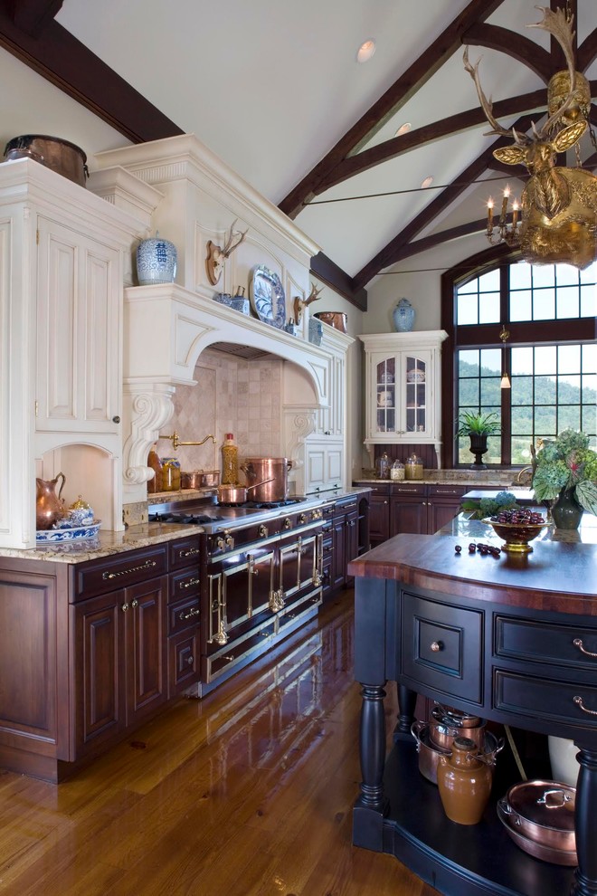 Enclosed kitchen - mid-sized transitional single-wall light wood floor and brown floor enclosed kitchen idea in DC Metro with an integrated sink, raised-panel cabinets, white cabinets, wood countertops, white backsplash, wood backsplash, stainless steel appliances and an island