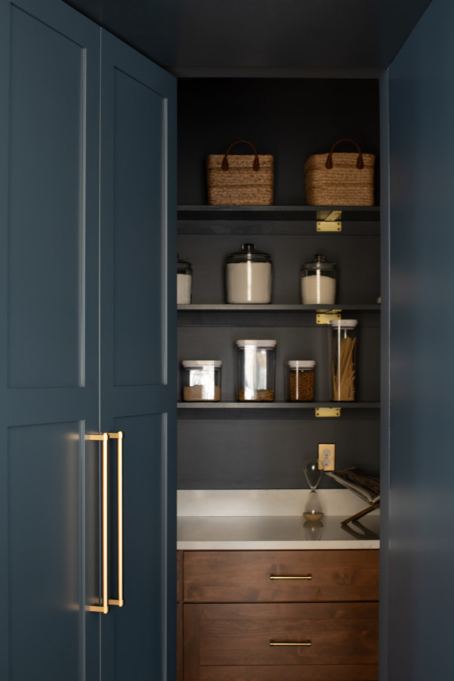 Kitchen - large transitional light wood floor kitchen idea with an undermount sink, shaker cabinets, blue cabinets, quartz countertops, white backsplash, quartz backsplash, stainless steel appliances, an island and white countertops