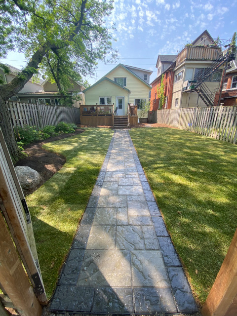 Simple Backyard Makeover - interlock walkway and sod garden
