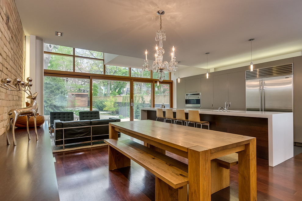 Photo of a contemporary open plan dining in Toronto with dark hardwood floors.