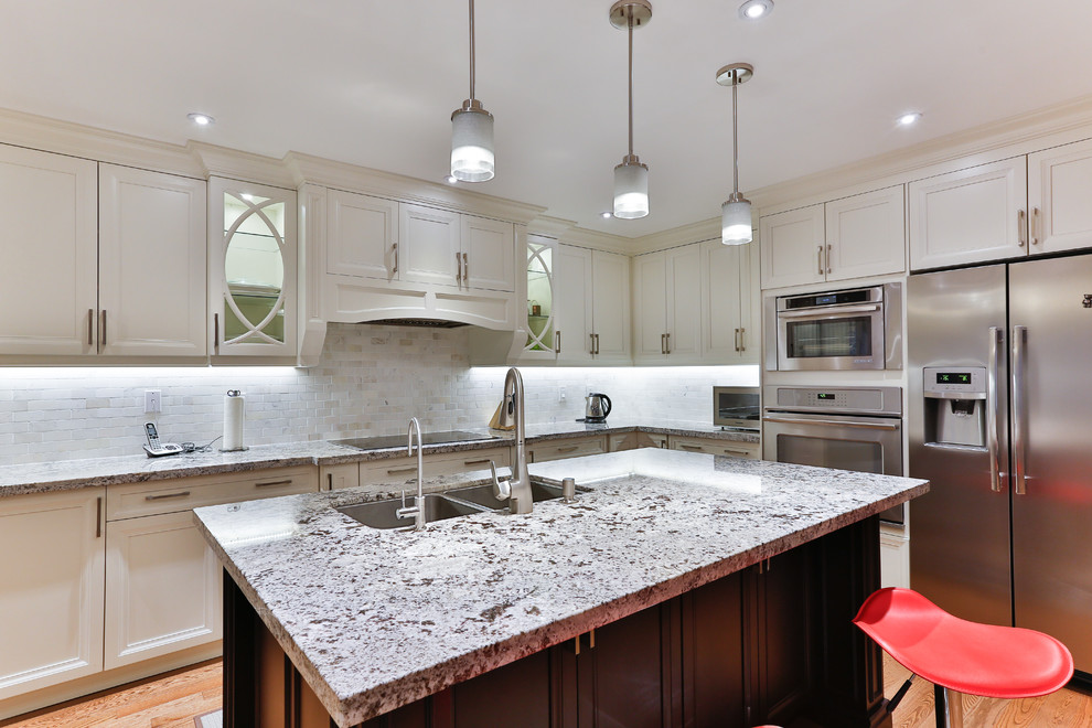 Example of a transitional kitchen design in Toronto