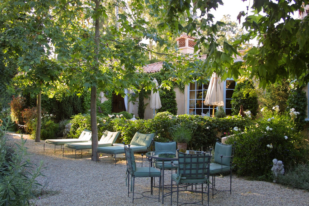 Inspiration for a mid-sized mediterranean backyard garden in Santa Barbara with gravel.