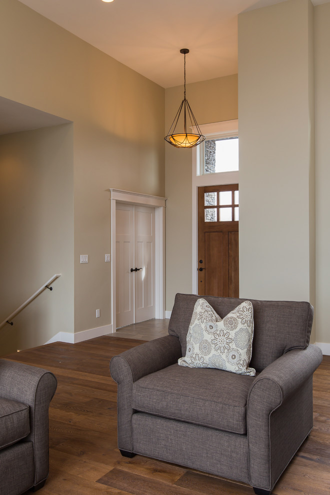 Photo of a large contemporary front door in Portland with beige walls, medium hardwood floors, a single front door and a medium wood front door.