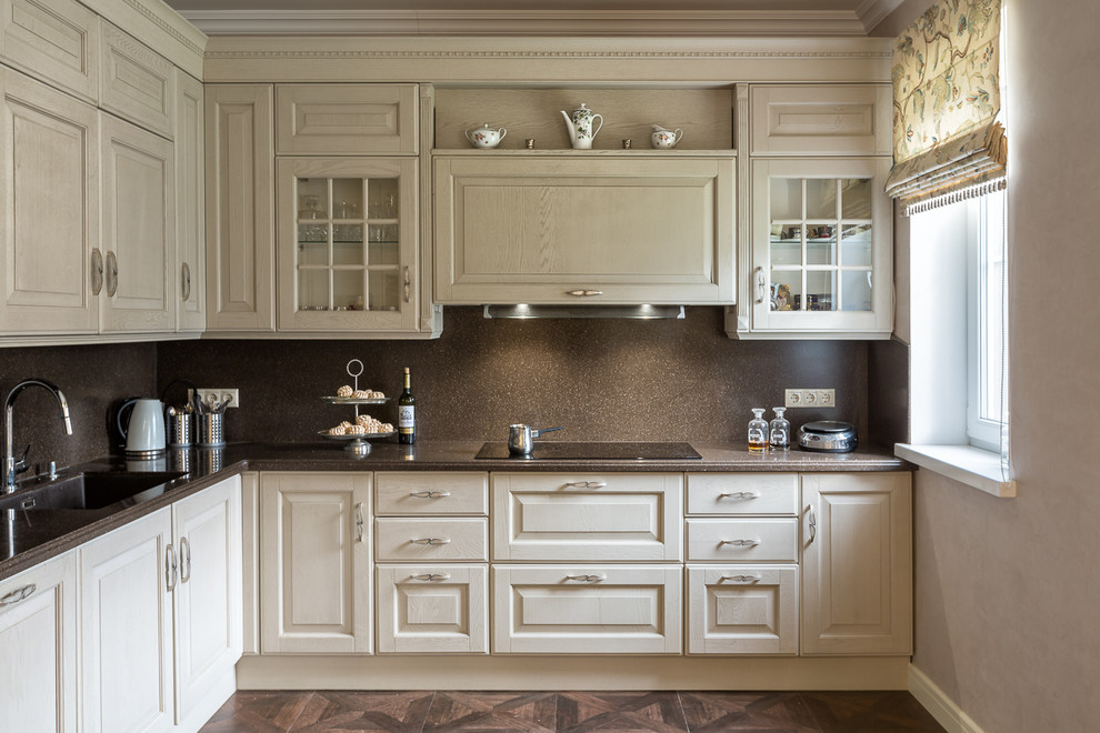 Traditional l-shaped open plan kitchen in Other with an undermount sink, raised-panel cabinets, light wood cabinets, brown splashback, dark hardwood floors and no island.