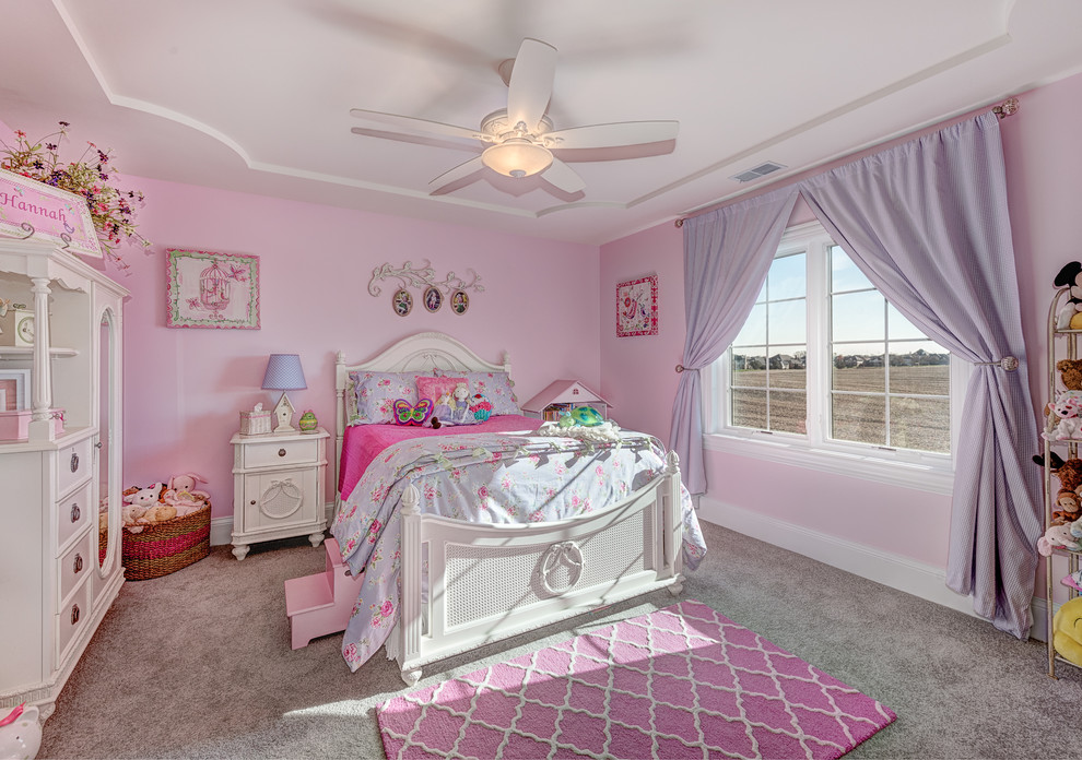Inspiration for a large traditional kids' bedroom for kids 4-10 years old and girls in Chicago with pink walls, carpet and grey floor.