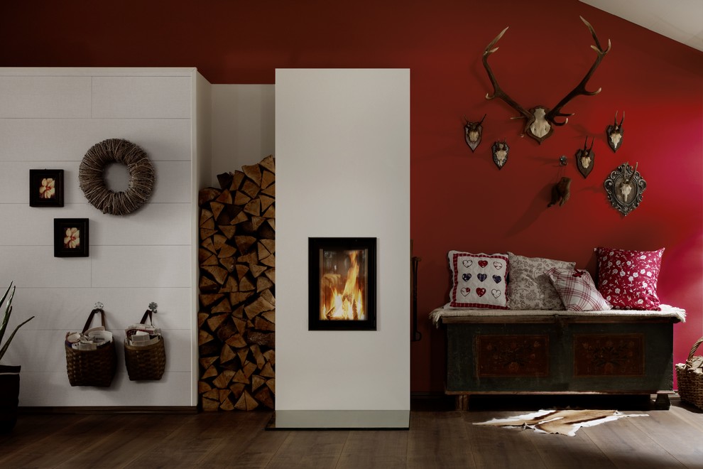 Living room - rustic living room idea in Vancouver with a hanging fireplace