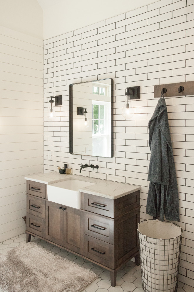 Photo of a large country bathroom in Other with shaker cabinets, dark wood cabinets, a claw-foot tub, an alcove shower, a bidet, white tile, ceramic tile, white walls, porcelain floors, an undermount sink, quartzite benchtops, white floor, a hinged shower door, white benchtops, a double vanity, a freestanding vanity and planked wall panelling.