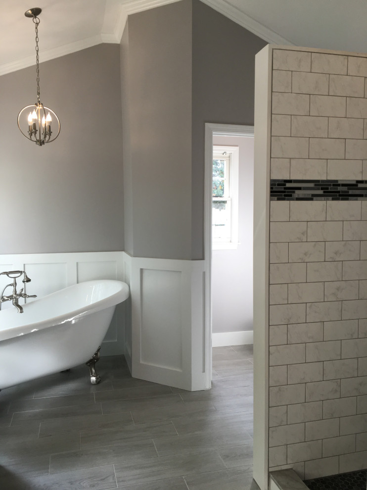 Design ideas for a large arts and crafts master bathroom in Atlanta with shaker cabinets, black cabinets, a claw-foot tub, an alcove shower, black and white tile, cement tile, grey walls, cement tiles, an undermount sink, marble benchtops, grey floor, a hinged shower door and white benchtops.