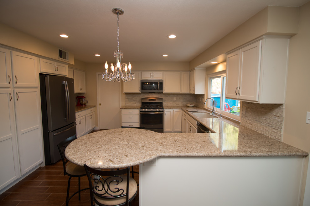 Mid-sized transitional u-shaped porcelain tile open concept kitchen photo with an undermount sink, recessed-panel cabinets, beige cabinets, quartz countertops, beige backsplash, mosaic tile backsplash and colored appliances