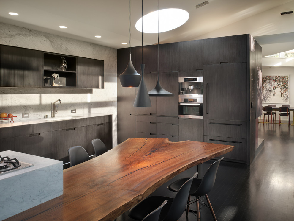 Design ideas for a modern eat-in kitchen in San Francisco with flat-panel cabinets, black cabinets, white splashback, stone slab splashback, dark hardwood floors and with island.
