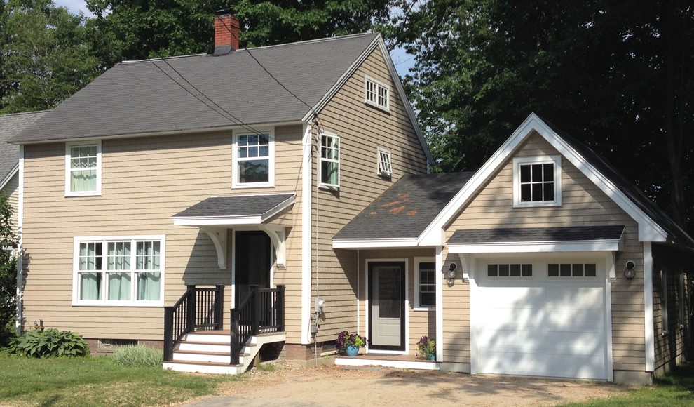 Design ideas for a mid-sized traditional three-storey beige exterior in Portland Maine with vinyl siding and a gable roof.