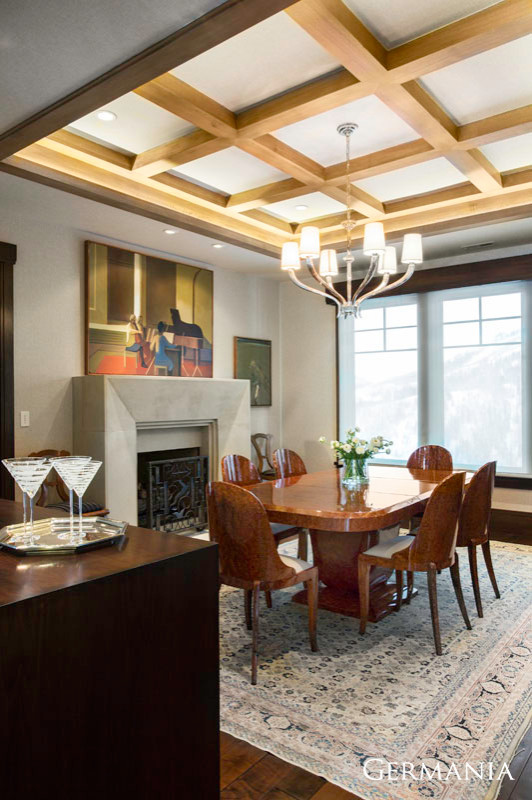 Design ideas for a classic dining room in Salt Lake City with white walls, medium hardwood flooring, a standard fireplace and a concrete fireplace surround.