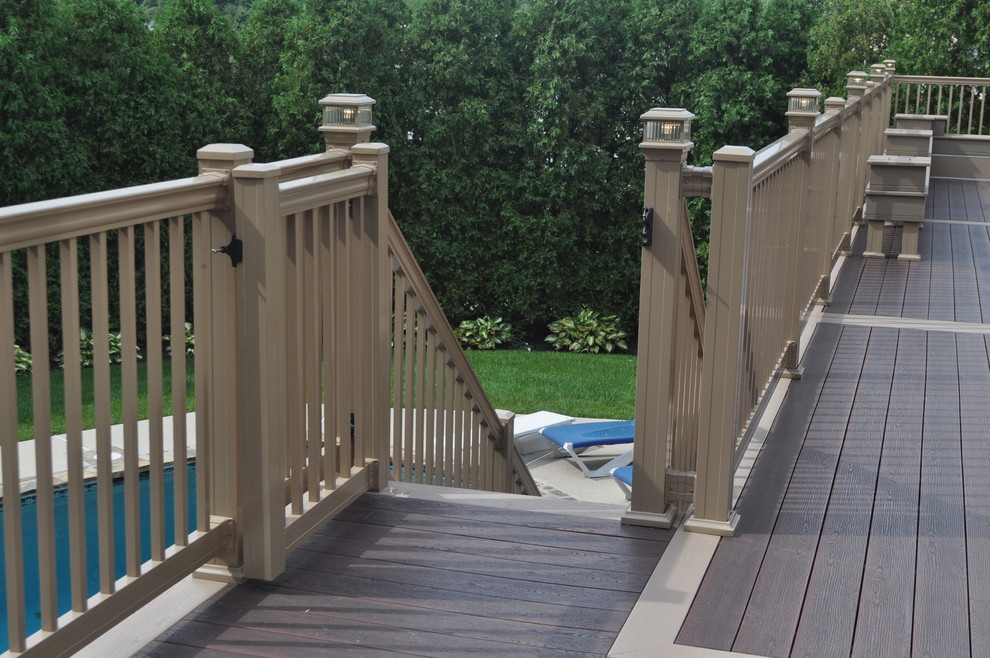 Deck - mid-sized transitional backyard deck idea with no cover