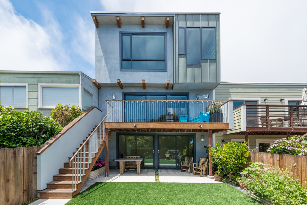 Photo of a mid-sized contemporary three-storey grey exterior in San Francisco with mixed siding and a flat roof.