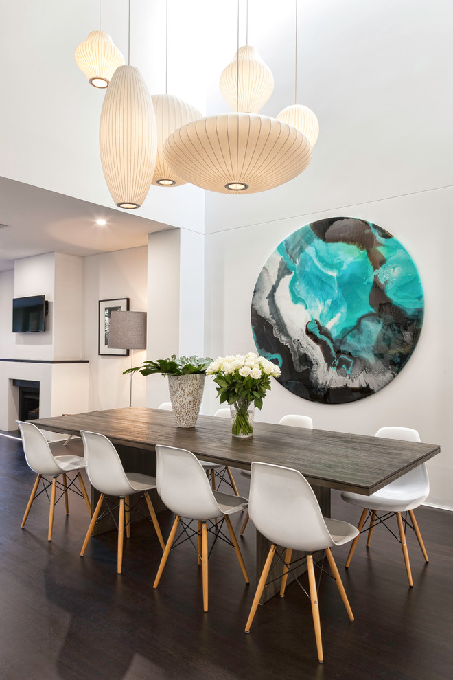 This is an example of a mid-sized contemporary dining room in Melbourne with white walls and dark hardwood floors.