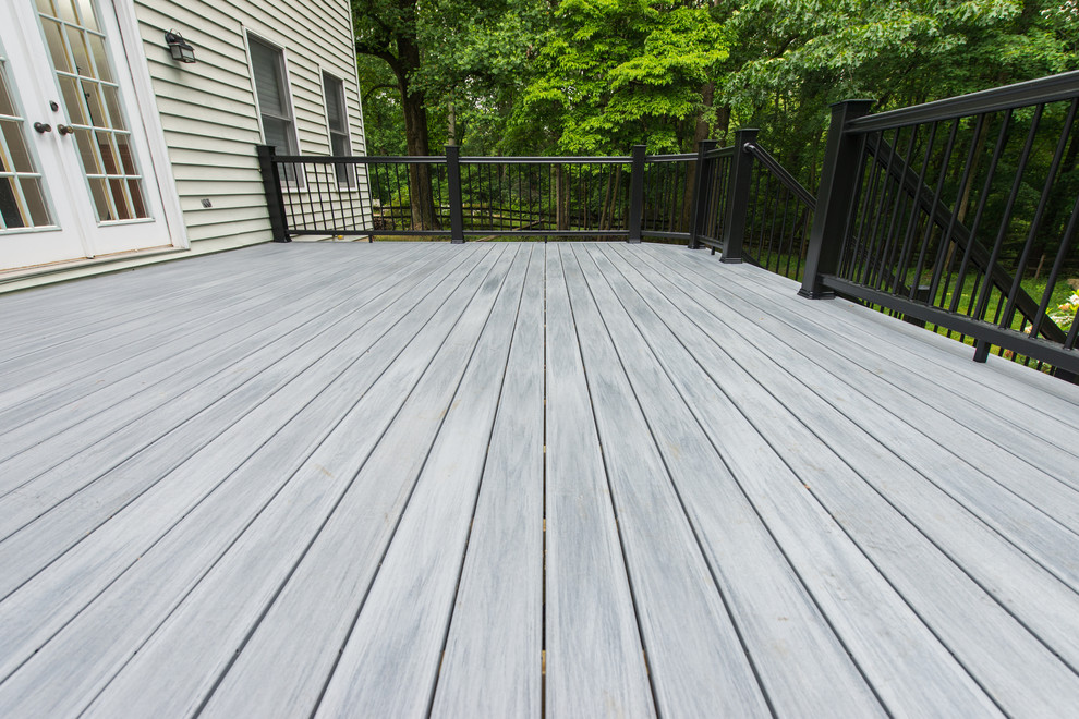 Example of a mid-sized backyard deck design in Baltimore with no cover